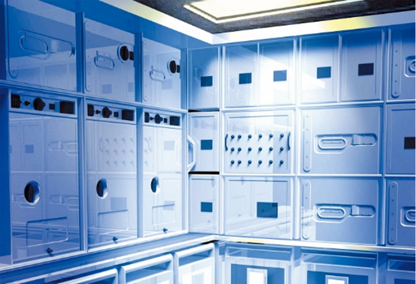 Blue-toned indoor industrial control or server room.